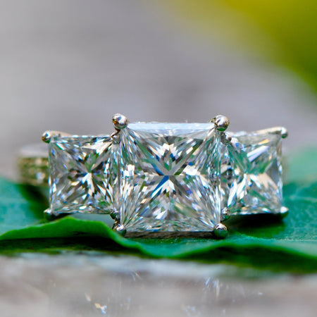 Three stone princess cut diamond engagement ring